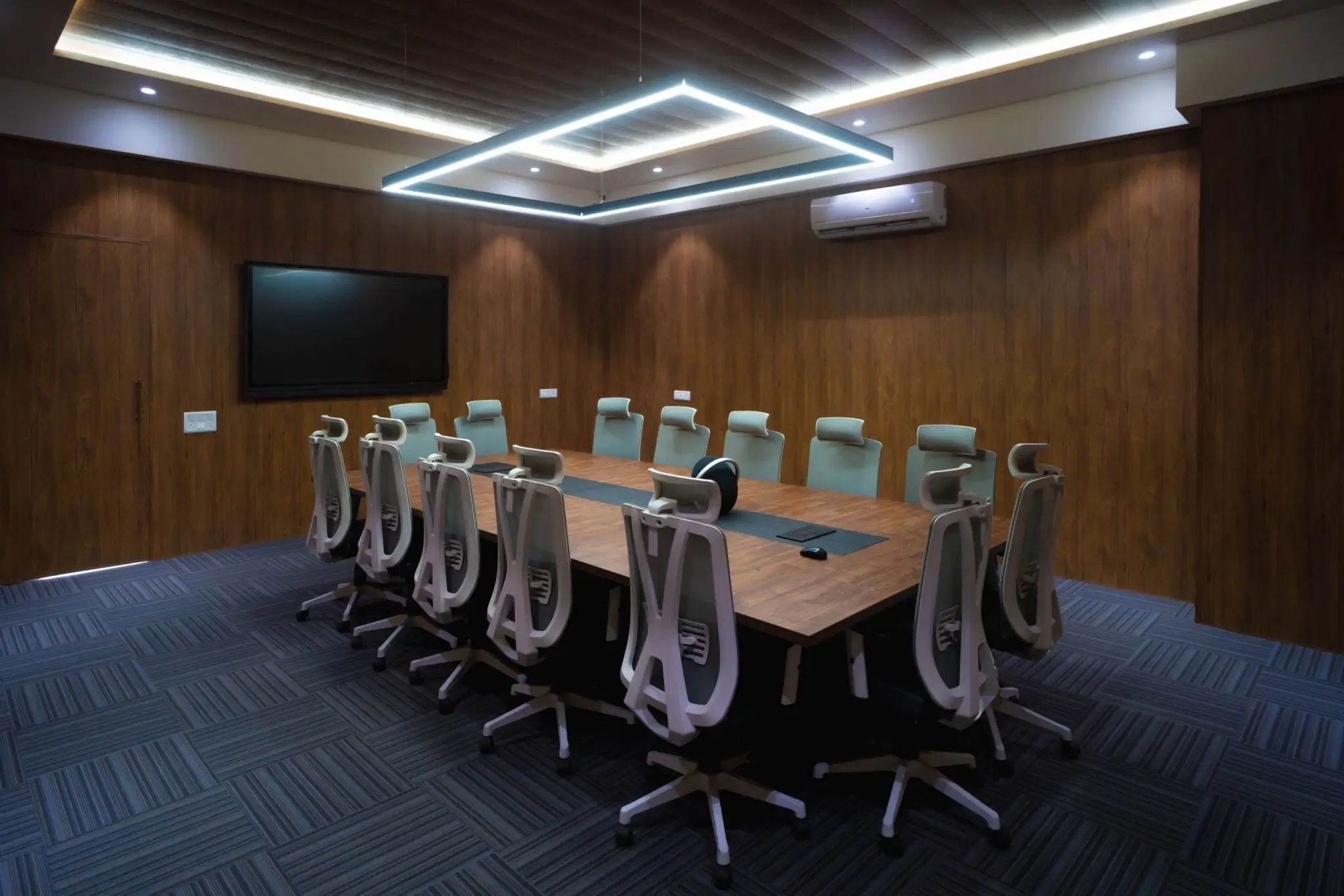 Modern conference and meeting room with premium seating and digital presentation setup at a top MBA college in Ahmedabad Gujarat.